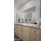 Bathroom featuring a granite countertop vanity with plenty of storage and decorative hardware at 11011 N 92Nd St # 1157, Scottsdale, AZ 85260