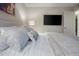 Comfortable bedroom featuring a queen-size bed, mounted TV, and ample natural light at 11011 N 92Nd St # 1157, Scottsdale, AZ 85260