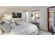 Spacious bedroom with a mirrored closet, television, and an adjacent outdoor door at 11011 N 92Nd St # 1157, Scottsdale, AZ 85260