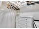 Functional closet with white drawers, hangers, and ample storage for clothes and accessories at 11011 N 92Nd St # 1157, Scottsdale, AZ 85260