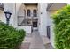 Charming condo entrance with private access stairs, landscaped grounds, and wrought iron details at 11011 N 92Nd St # 1157, Scottsdale, AZ 85260