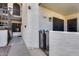 Close up exterior of building shows lush plants and an entry gate to a ground floor condo at 11011 N 92Nd St # 1157, Scottsdale, AZ 85260