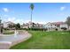 Beautifully landscaped community featuring a sparkling water feature and lush green lawns under a clear blue sky at 11011 N 92Nd St # 1157, Scottsdale, AZ 85260