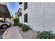 Exterior view shows building facade, landscape, and dedicated covered parking space at 11011 N 92Nd St # 1157, Scottsdale, AZ 85260