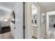 Hallway view leading to a bathroom with matching granite countertops and modern fixtures at 11011 N 92Nd St # 1157, Scottsdale, AZ 85260