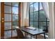 A cozy home office featuring a desk, chair, and plenty of natural light from the window at 11011 N 92Nd St # 1157, Scottsdale, AZ 85260