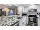 Modern kitchen features stainless steel appliances, granite countertops, and ample cabinet space at 11011 N 92Nd St # 1157, Scottsdale, AZ 85260