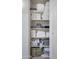 Well-organized linen closet featuring neatly stacked towels and bedding on multiple shelves, maximizing storage space at 11011 N 92Nd St # 1157, Scottsdale, AZ 85260