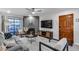 Cozy living room boasts stylish fireplace, TV, comfortable seating, and modern accents at 11011 N 92Nd St # 1157, Scottsdale, AZ 85260