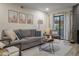 Inviting living room featuring neutral colors, modern furniture, and access to an outdoor patio at 11011 N 92Nd St # 1157, Scottsdale, AZ 85260