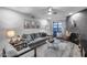 Inviting living room features modern decor, gray sofa, unique accents, and lots of natural light at 11011 N 92Nd St # 1157, Scottsdale, AZ 85260