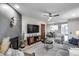 Open-concept living space with modern decor, a sleek fireplace, and seamless flow to the dining area at 11011 N 92Nd St # 1157, Scottsdale, AZ 85260