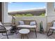 Cozy outdoor patio with comfortable wicker seating, perfect for relaxation and enjoying the fresh air at 11011 N 92Nd St # 1157, Scottsdale, AZ 85260