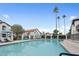 Resort-style swimming pool with lounge chairs, offering a relaxing and luxurious amenity for residents at 11011 N 92Nd St # 1157, Scottsdale, AZ 85260