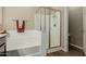 Bathroom featuring a shower and soaking tub with modern fixtures and finishes at 11023 E Shepperd Ave, Mesa, AZ 85212