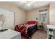 Cozy bedroom featuring a comfortable bed and a bright window providing natural light at 11023 E Shepperd Ave, Mesa, AZ 85212