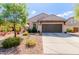 Charming single-story home with a well-maintained front yard and a two car garage at 11023 E Shepperd Ave, Mesa, AZ 85212
