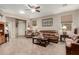 Comfortable living room with neutral tones, tile floors, and cozy seating arrangement at 11023 E Shepperd Ave, Mesa, AZ 85212