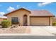 Charming single-story home featuring a tile roof and well-maintained desert landscaping for easy maintenance at 12007 S Crow Ct, Phoenix, AZ 85044