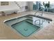 Community hot tub with tiled accents and a large window view at 12007 S Crow Ct, Phoenix, AZ 85044