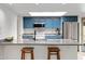 Modern kitchen featuring a skylight, stainless steel appliances, granite counters, and breakfast bar at 12007 S Crow Ct, Phoenix, AZ 85044