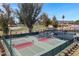 Community tennis courts are well-maintained and surrounded by green landscaping, offering a great outdoor experience at 12007 S Crow Ct, Phoenix, AZ 85044