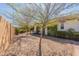 Charming backyard featuring mature landscaping and covered patio offering serene outdoor space at 1209 E Park Ave, Chandler, AZ 85225