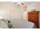 Primary bedroom featuring neutral color palette, ceiling fan, and ensuite bathroom at 1209 E Park Ave, Chandler, AZ 85225