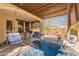 Relaxing covered patio with comfortable seating, string lights, and stylish decor for outdoor enjoyment at 1209 E Park Ave, Chandler, AZ 85225