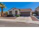 Charming single-story home with a well-maintained front yard, two-car garage, and a desert landscape at 1209 E Park Ave, Chandler, AZ 85225