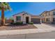 Charming single-story home with a well-maintained front yard, two-car garage, and a desert landscape at 1209 E Park Ave, Chandler, AZ 85225