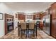 Eat-in kitchen featuring updated appliances, ample cabinet space, and an adjacent fireplace for cozy dining at 1209 E Park Ave, Chandler, AZ 85225