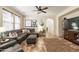 Cozy living room featuring tile floors, a ceiling fan, and comfortable seating with natural light at 1209 E Park Ave, Chandler, AZ 85225