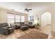 Comfortable living room with tile flooring, a ceiling fan, and neutral décor at 1209 E Park Ave, Chandler, AZ 85225