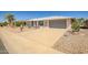 Charming single-story home with a well-maintained desert landscaped front yard and a two-car garage at 13114 W Castlebar Dr, Sun City West, AZ 85375