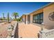 Inviting front patio area with decorative ironwork, tiled surface, and space for outdoor seating at 13114 W Castlebar Dr, Sun City West, AZ 85375