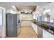 Well-lit kitchen featuring modern stainless steel appliances and granite countertops at 13114 W Castlebar Dr, Sun City West, AZ 85375