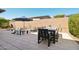 Beautiful backyard featuring a dining set, pool, and lounge chairs, perfect for outdoor relaxation and entertaining at 13418 W Mayberry Trl, Peoria, AZ 85383