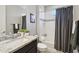 Cozy bathroom featuring a bathtub with shower, modern vanity, and tasteful decor creates a relaxing space at 13418 W Mayberry Trl, Peoria, AZ 85383