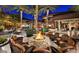 Cozy outdoor firepit area surrounded by comfortable seating, perfect for gatherings and relaxation under the stars at 13418 W Mayberry Trl, Peoria, AZ 85383