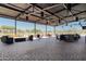 Large outdoor patio with ample seating, perfect for dining and enjoying the scenic views of the surrounding landscape at 13418 W Mayberry Trl, Peoria, AZ 85383