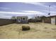 View of backyard with the shed with white trim and exterior lighting at 1518 N Gilbert Ave, Casa Grande, AZ 85122