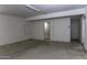 Unfinished basement featuring concrete flooring and access doors to other rooms at 1518 N Gilbert Ave, Casa Grande, AZ 85122