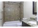Bathroom featuring tile shower, vanity and sink, granite countertop and new toilet at 1518 N Gilbert Ave, Casa Grande, AZ 85122