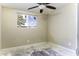 Bedroom featuring a window with view of the backyard and natural lighting at 1518 N Gilbert Ave, Casa Grande, AZ 85122