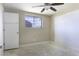 A bedroom featuring a ceiling fan, window, and closet space, ready for personalization at 1518 N Gilbert Ave, Casa Grande, AZ 85122