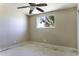 Bedroom with ceiling fan and view from window including palm trees. Ready for personalization at 1518 N Gilbert Ave, Casa Grande, AZ 85122