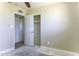 Bedroom with ceiling fan and view to closet, with natural lighting from the window at 1518 N Gilbert Ave, Casa Grande, AZ 85122