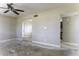 Spacious living room featuring ceiling fan, neutral walls, and doorway to adjacent room at 1518 N Gilbert Ave, Casa Grande, AZ 85122