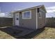 A well-maintained shed exterior with a charming entrance and landscaped brick trim at 1518 N Gilbert Ave, Casa Grande, AZ 85122